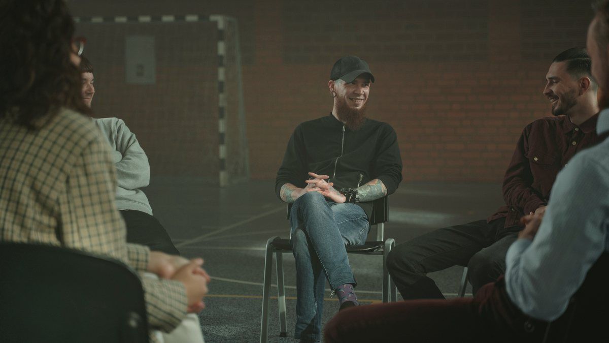 People sitting together in a support circle